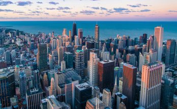 The Chicago skyline in front of an indigo blue Great Lake